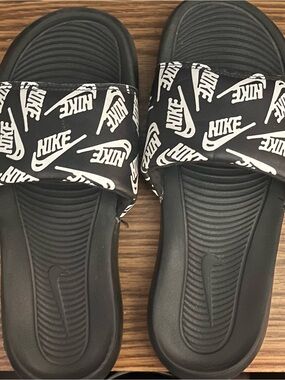 Nike Black Slides with White Logo Pattern